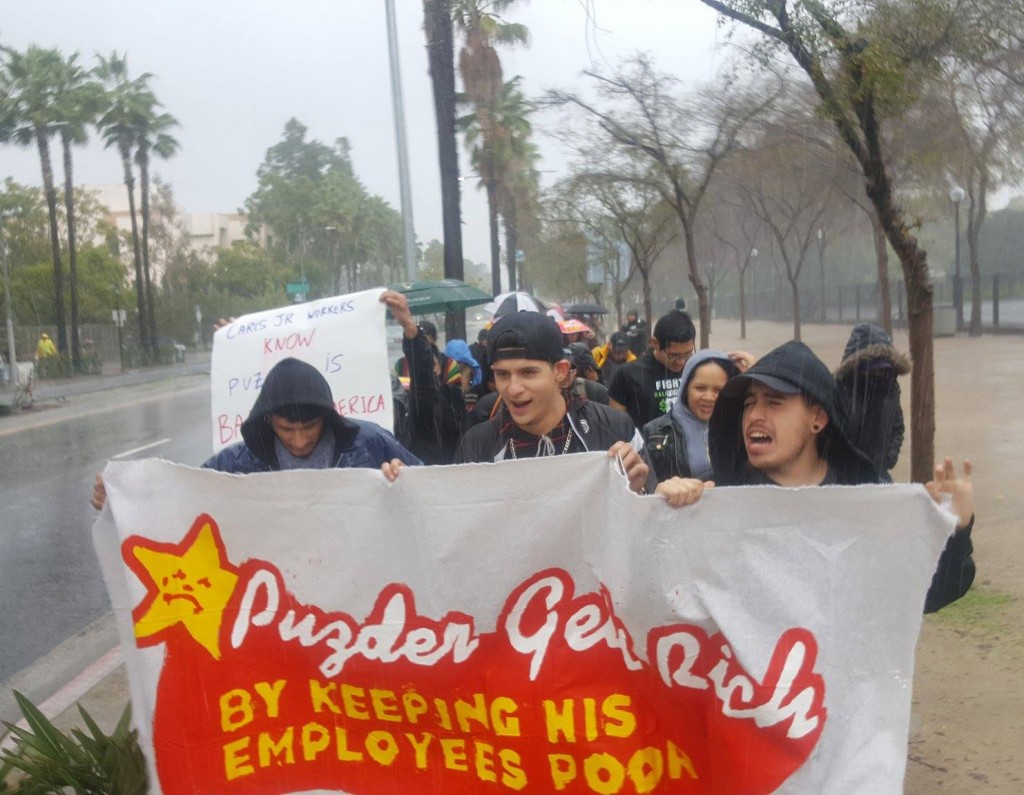 March in Los Angeles on Jan. 12 against Trump’s pick for Secretary of Labor, Andy Puzder, who runs Carls Jr. The workers chant: “Puzder gets rich by keeping his employees poor!” Photo: Fight for $15, Los Angeles